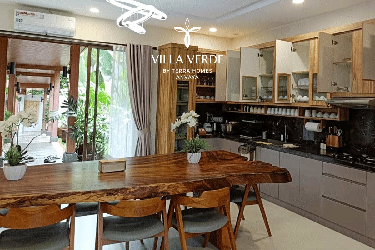 Live-edge dining table beside the open kitchen