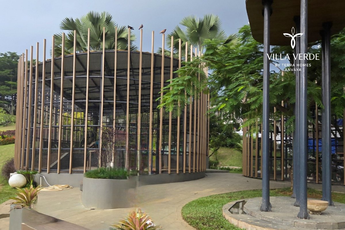 Modern bamboo-pillar entrance structure at the estate
